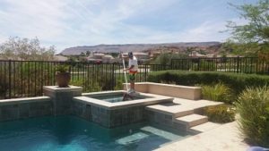 A man providing a weekly residential pool cleaning service in Las Vegas, NV